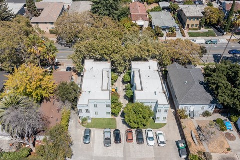 an aerial view of a neighborhood with houses and cars parked