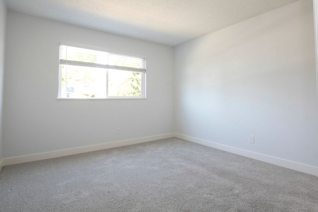 an empty room with a window in it