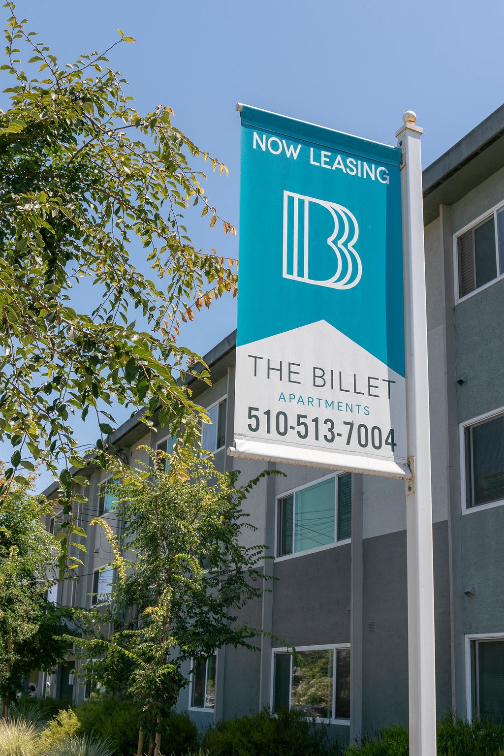 a sign for the bible apartments in front of a building