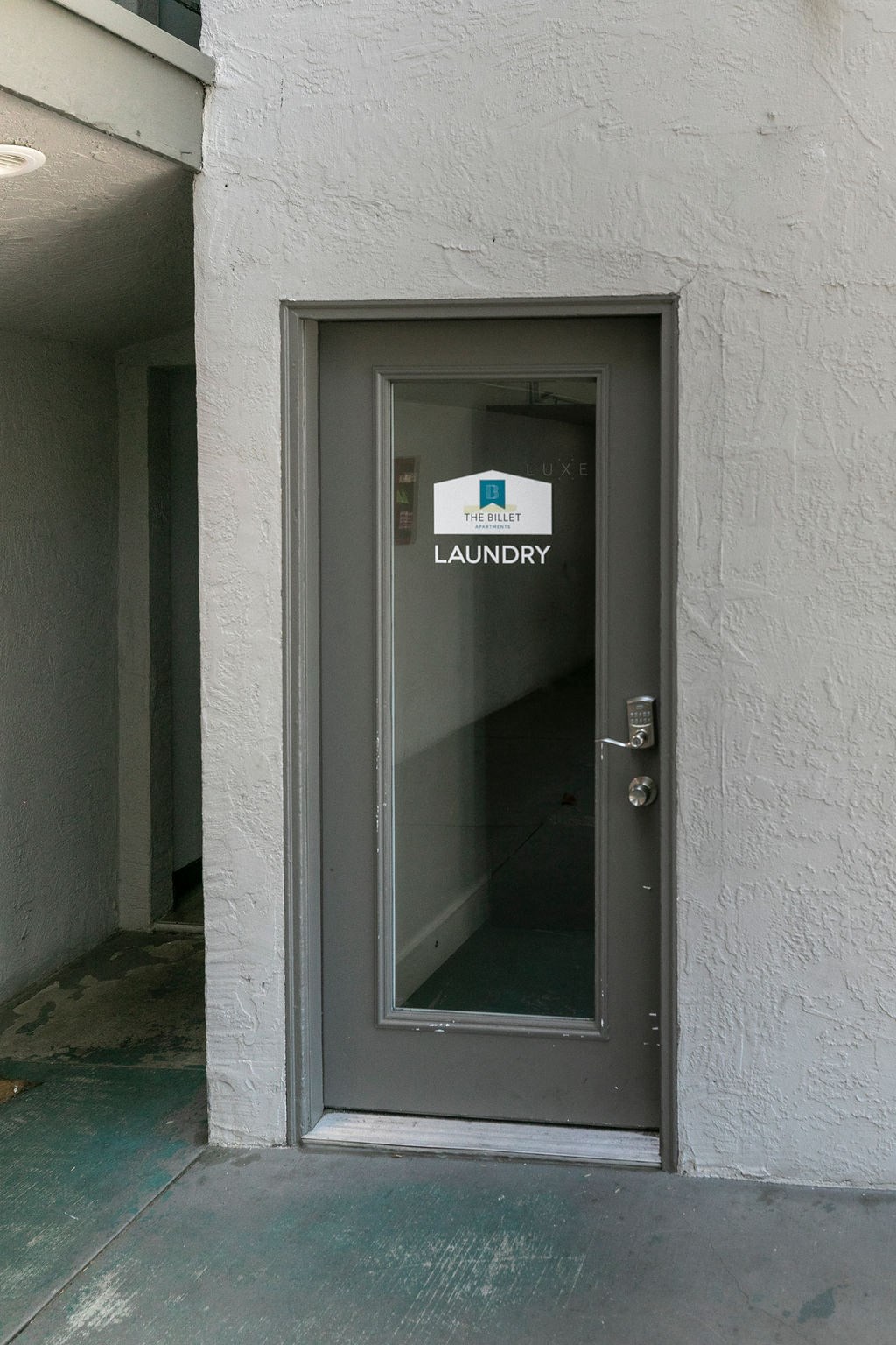 the door to the laundry room of the building