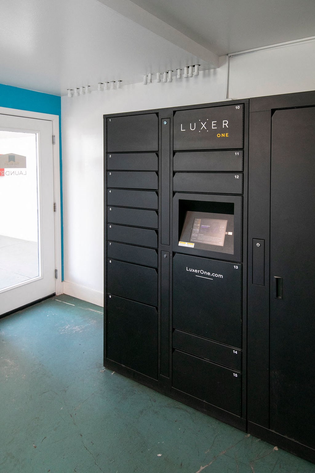 a group of black lockers in a room