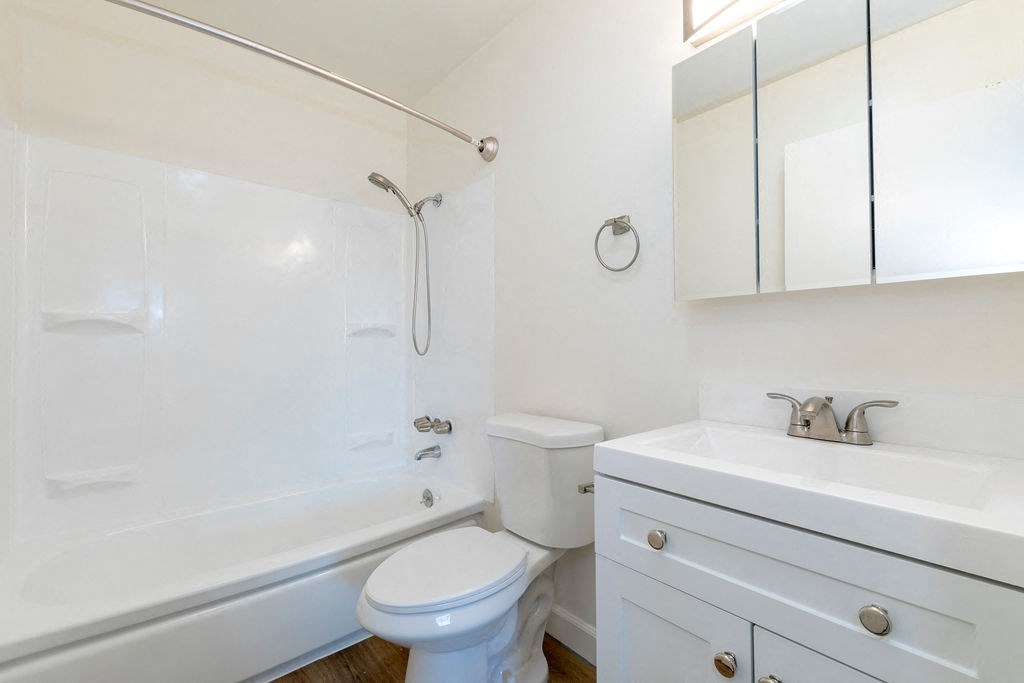 a bathroom with a sink toilet and a shower