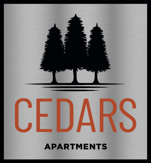 a logo for cedar apartments apartments with trees