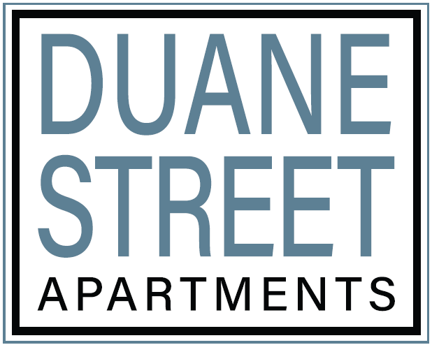 a white sign with the words dune street apartments