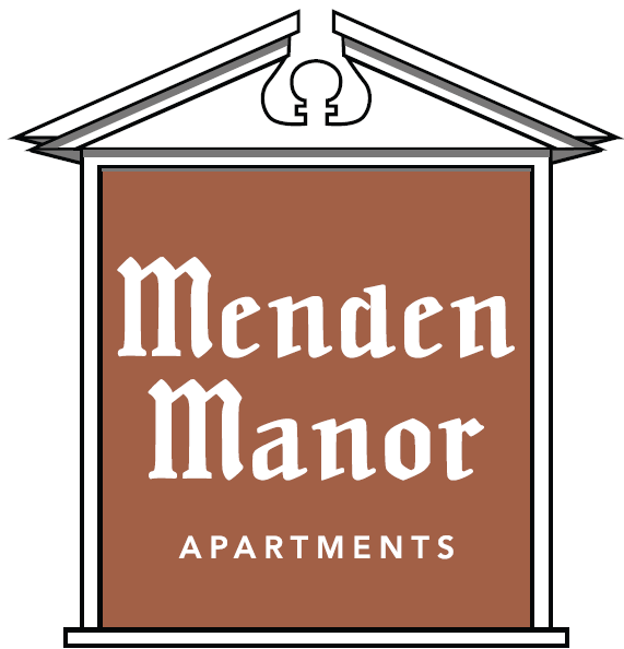 a small sign for mend mend manor apartments