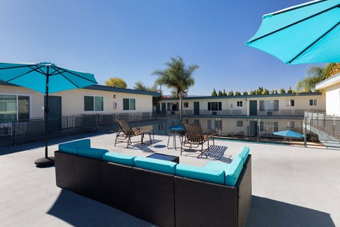 A sunny day at the outdoor pool area of a resort.