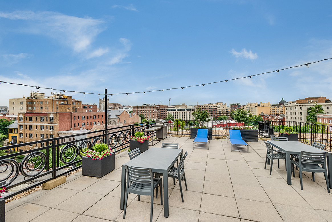 Rooftop deck with tables and seating at 1633 Q, Washington, DC, 20009