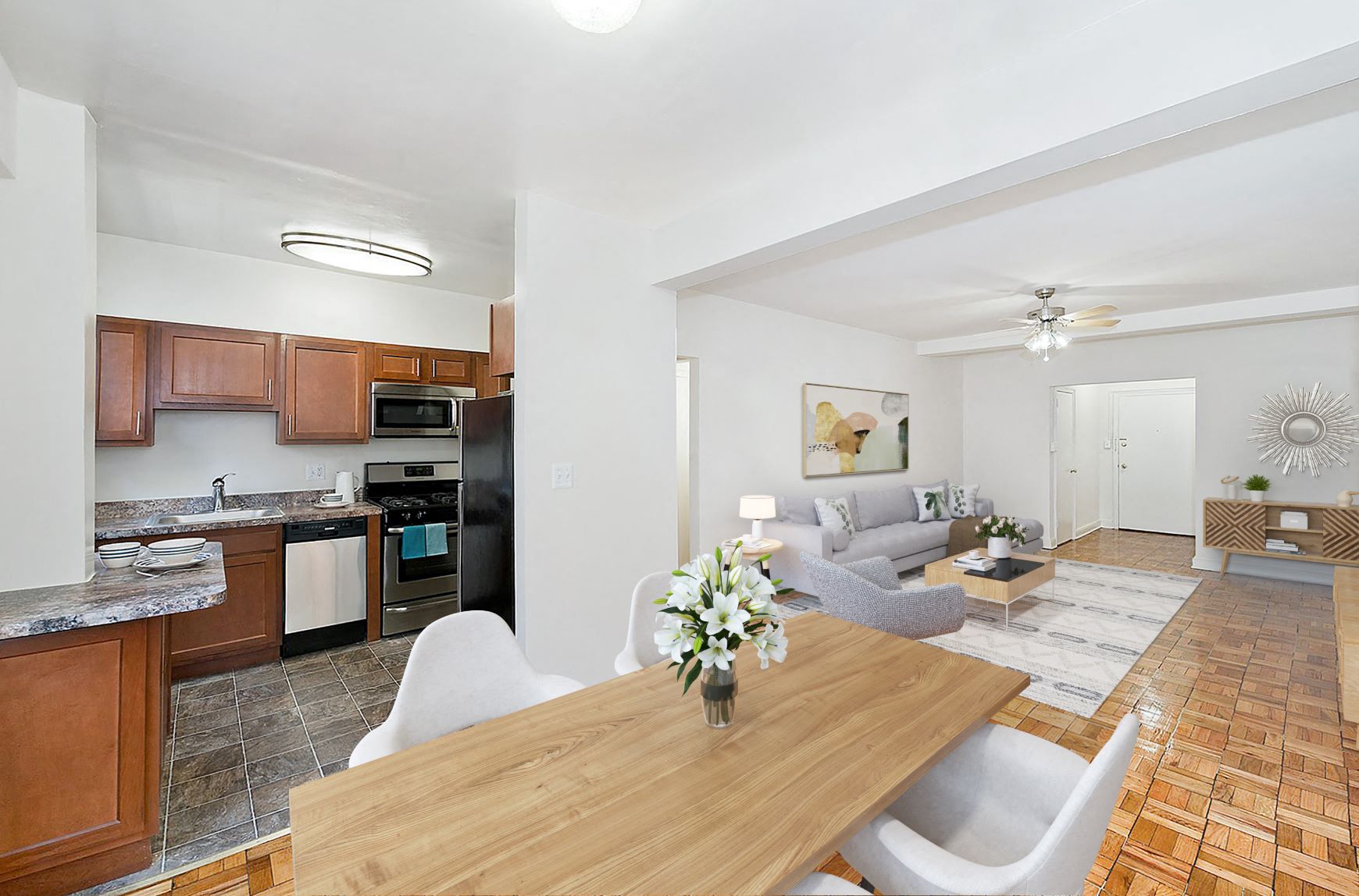a living room and kitchen with a wooden table