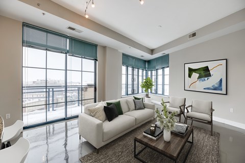 living room with floor to ceiling windows