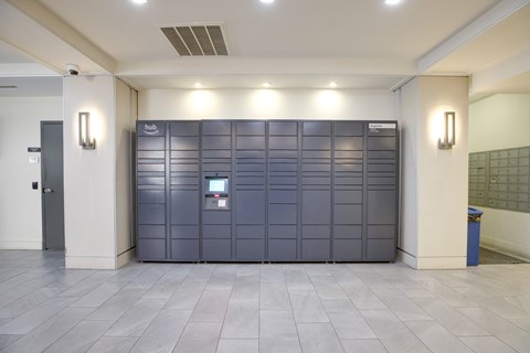 A large, dark grey, metal storage unit with a digital keypad on the front.