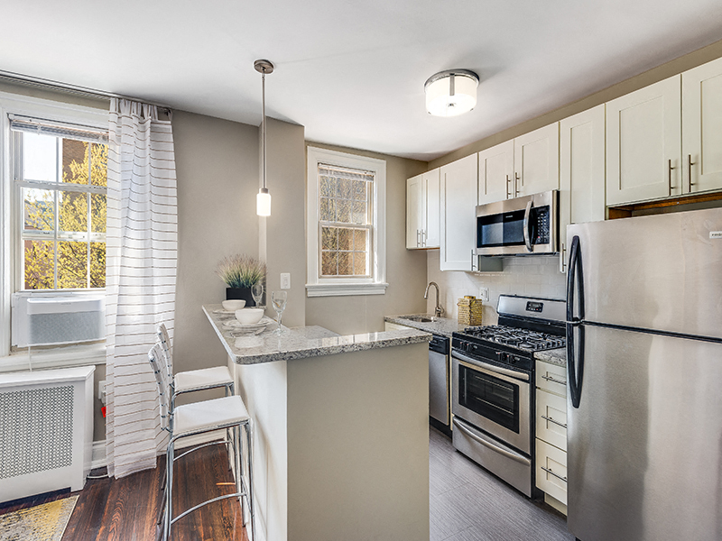 a kitchen with stainless steel appliances and a counter top