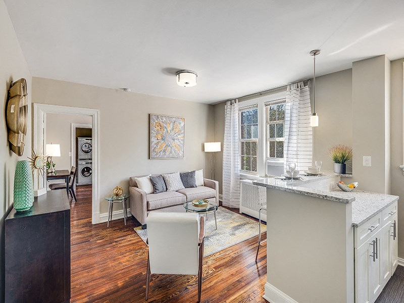 a living room with a kitchen and a couch