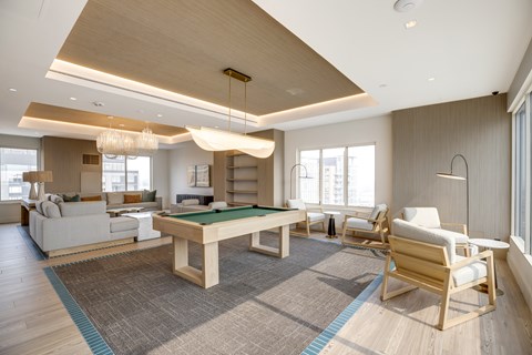 Newly renovated rooftop resident lounge with pool table at Lenox Club Apartments in National Landing, VA 22202