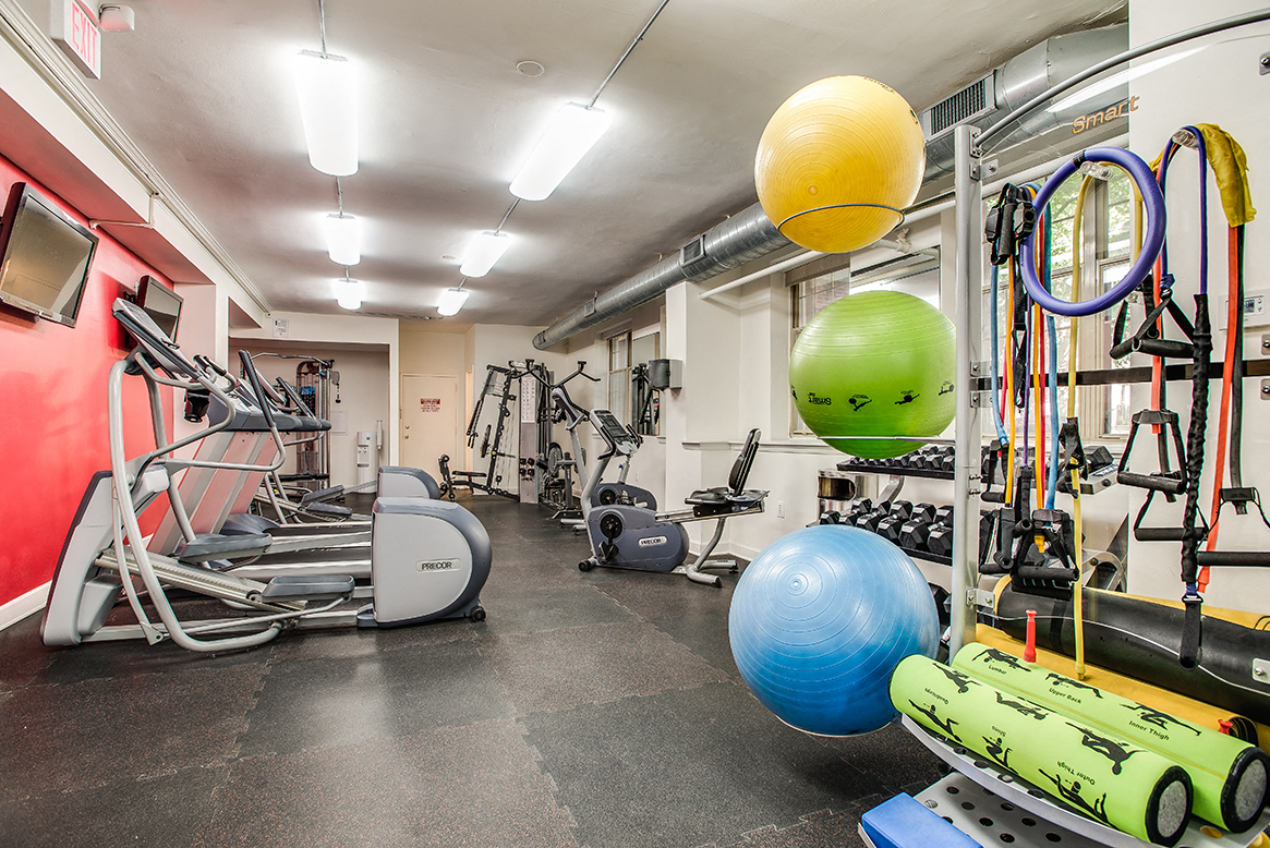 Fitness center with treadmills, machines and free weights at Cathedral Mansions, Washington, DC