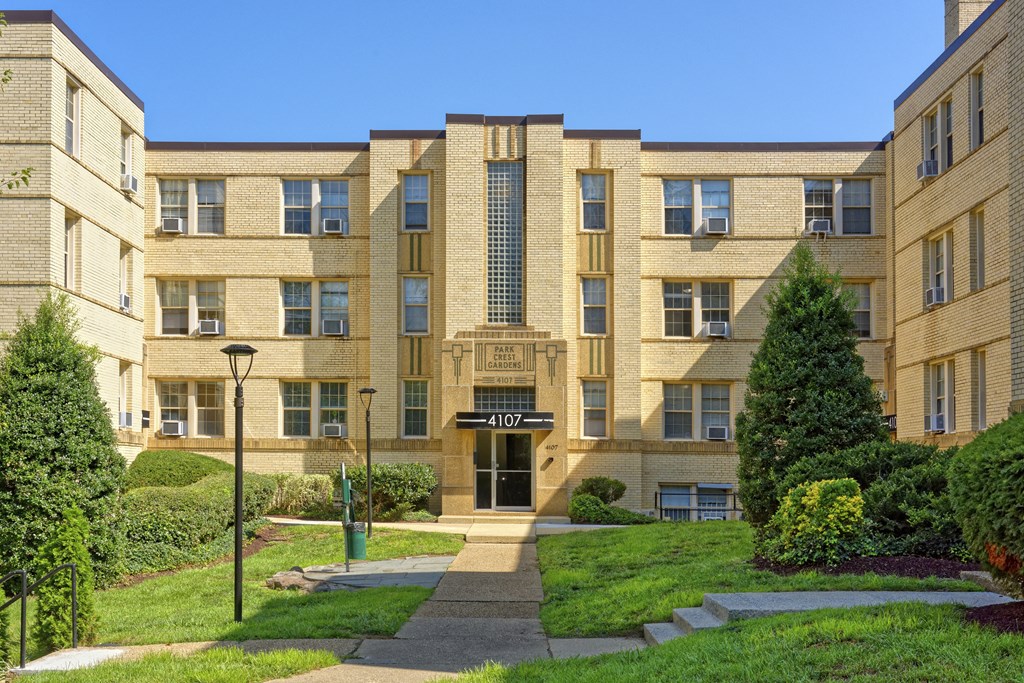 a large apartment building with a walkway in front of it at Park Crest Apartments, Washington, DC 20007