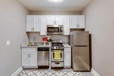 Studio apartment kitchen with stainless steel appliances at The York and Potomac Park, Washington, Washington