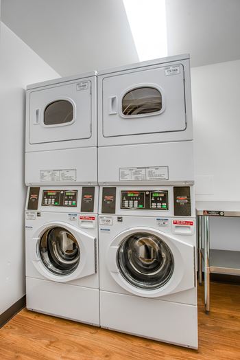 Laundry room with front-loading washer and dryer at Legation House, in the Chevy Chase neighborhood, in Washington, DC 20015