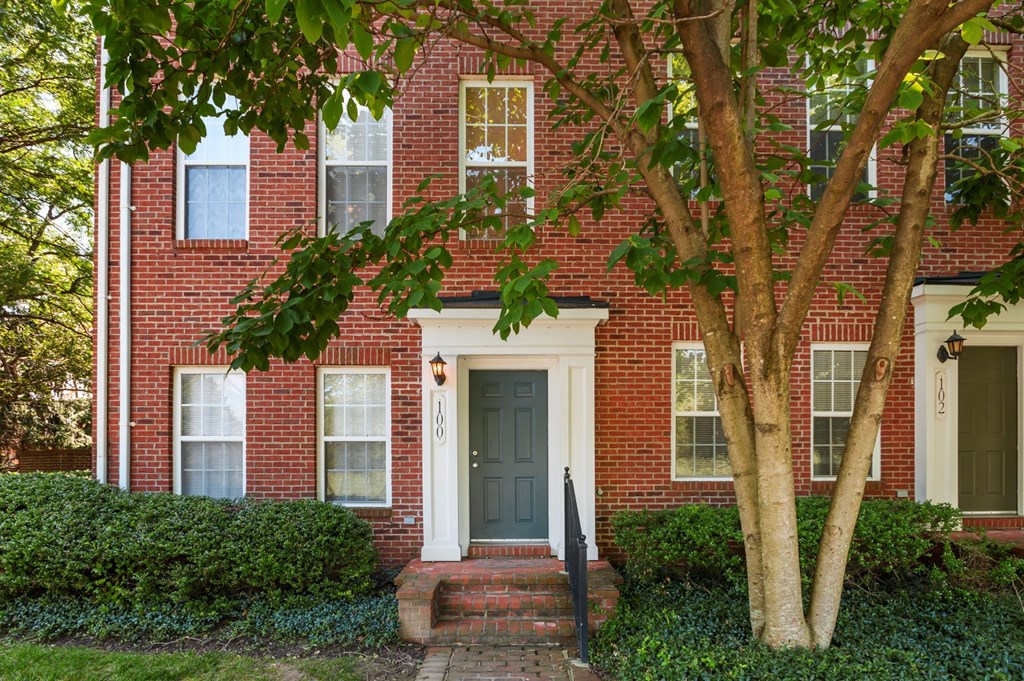 a house with a tree in front of it