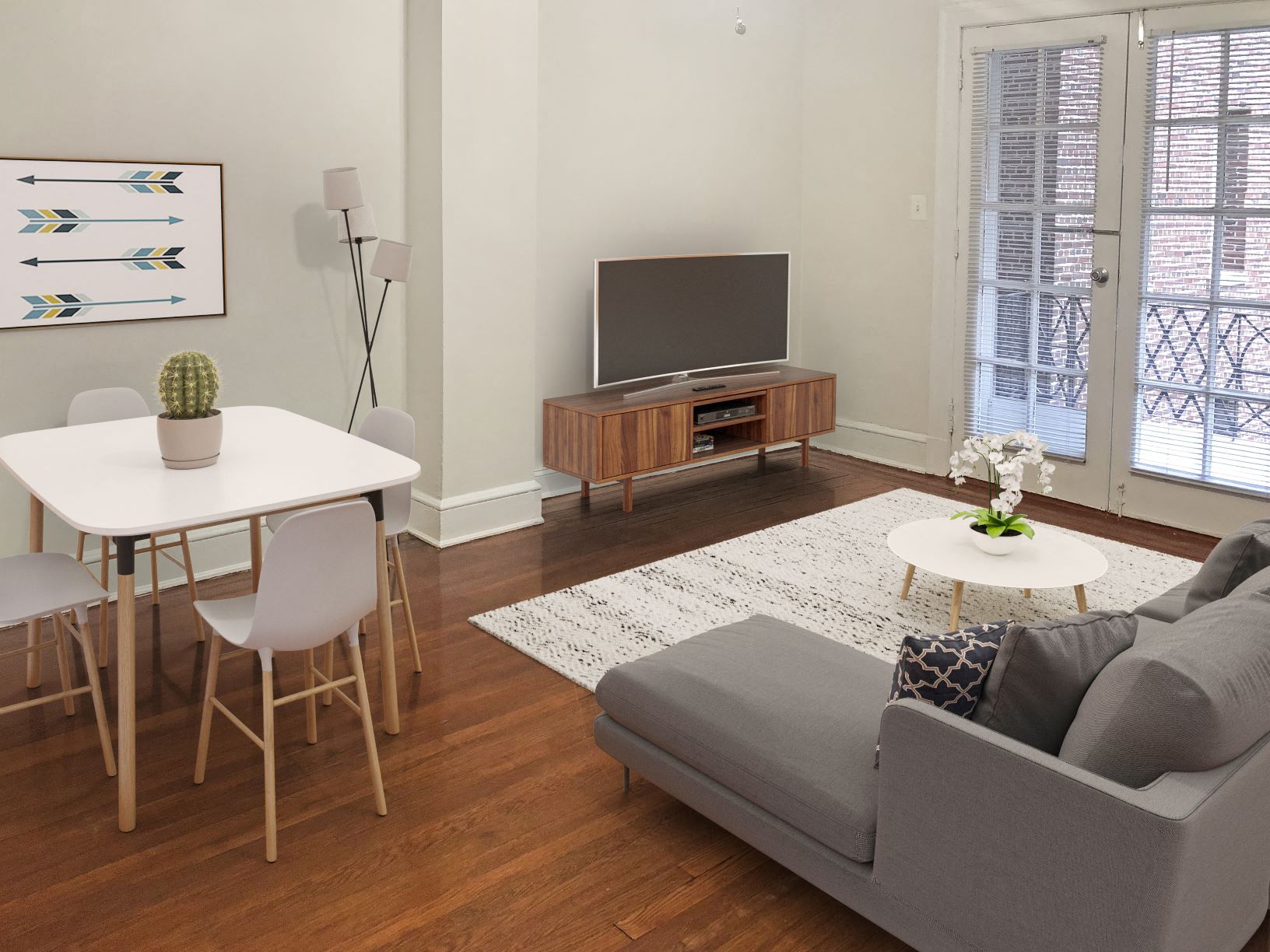 a living room with a couch and a table and a television