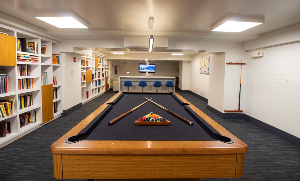 a room with a pool table and a television a room with a pool table and a television at The Argonne Apartments, Washington, 20009