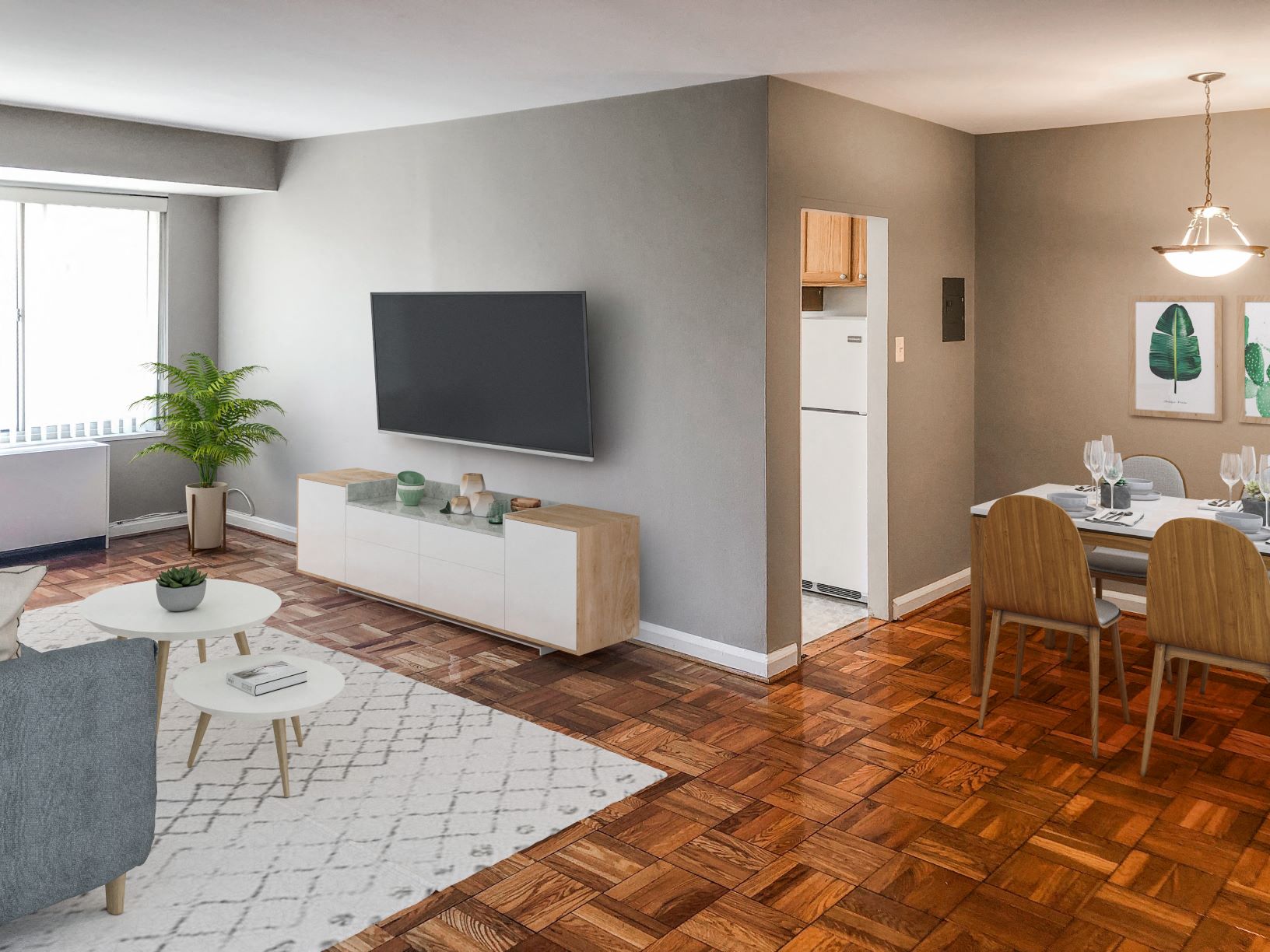 a living room and dining room with a table and a television