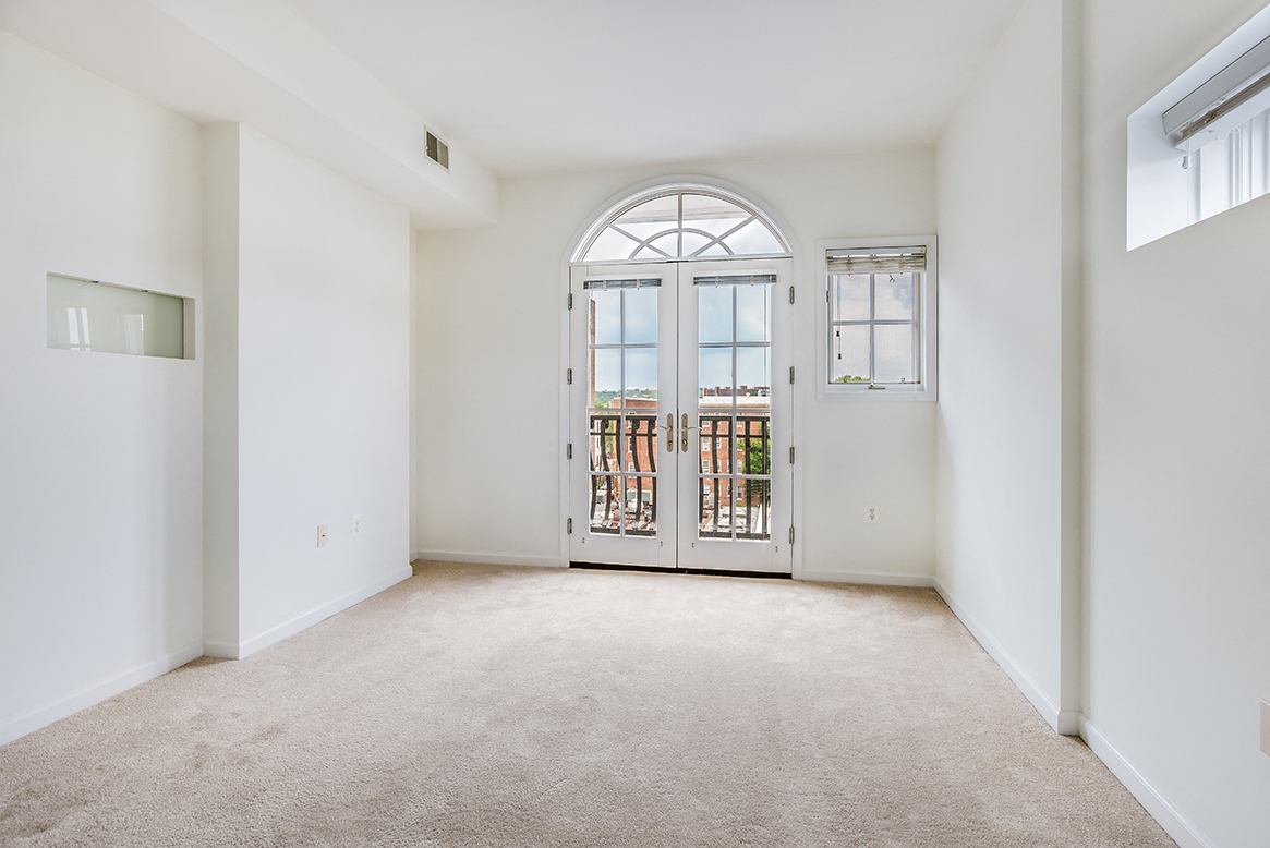 Apartment bedroom with balcony at Kalorama Park, Washington, DC 20009