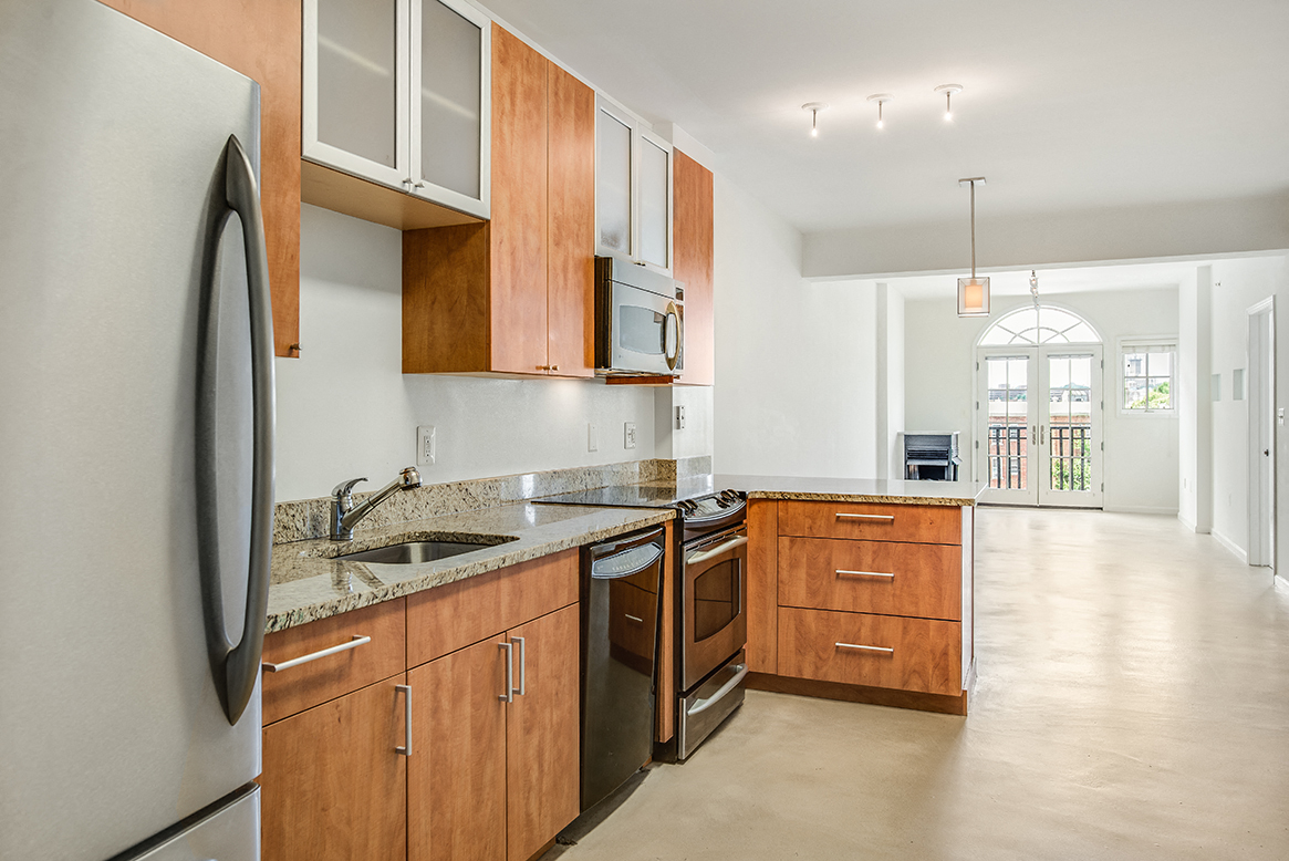 Renovated kitchen with granite at Kalorama Park, Washington, DC 20009countertops and stainless steel appliances