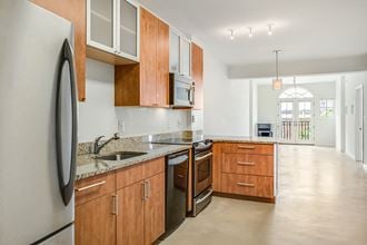 Renovated kitchen with granite at Kalorama Park, Washington, DC 20009countertops and stainless steel appliances