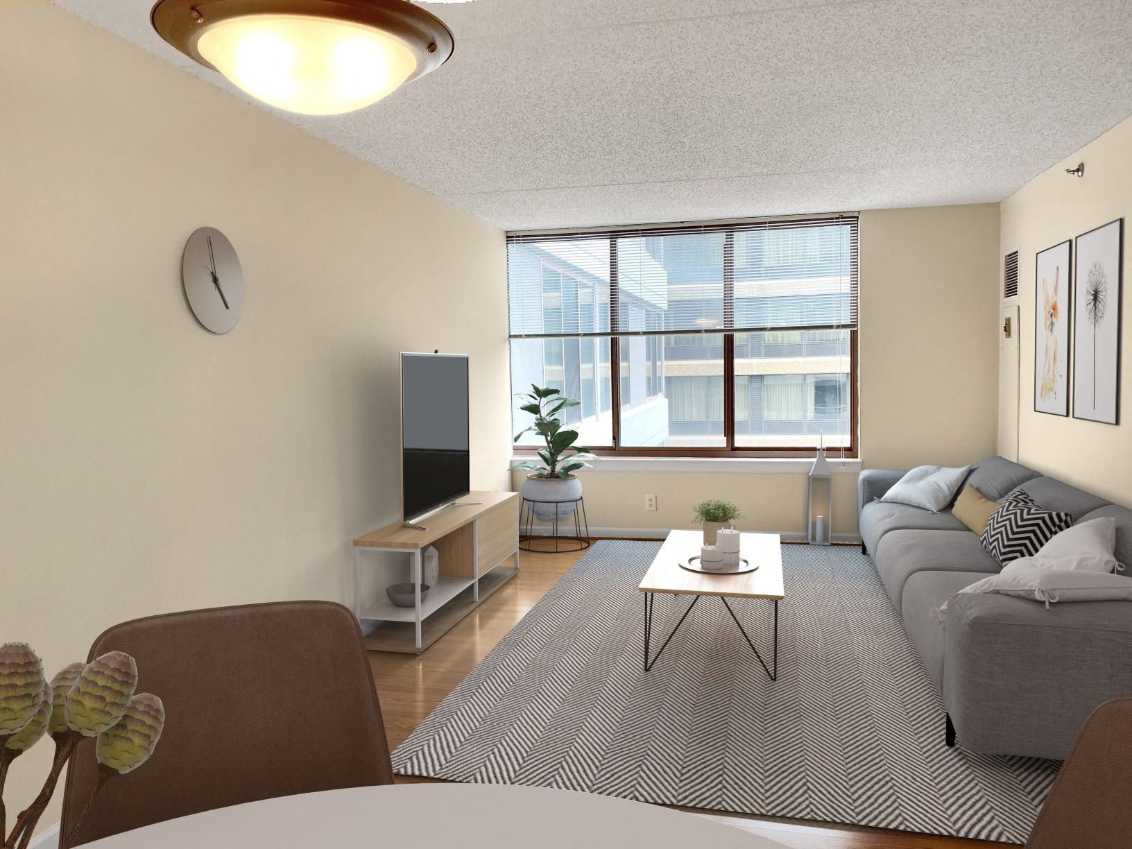 a living room with a couch and a table and a window