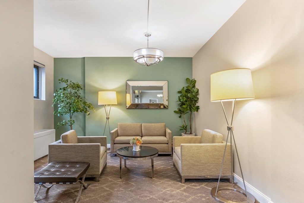 a living room with couches and chairs and a table