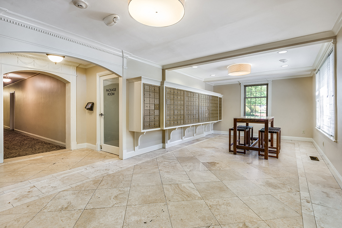 Lobby with post boxes and seating area at Mason Hall in Alexandria, VA 22314