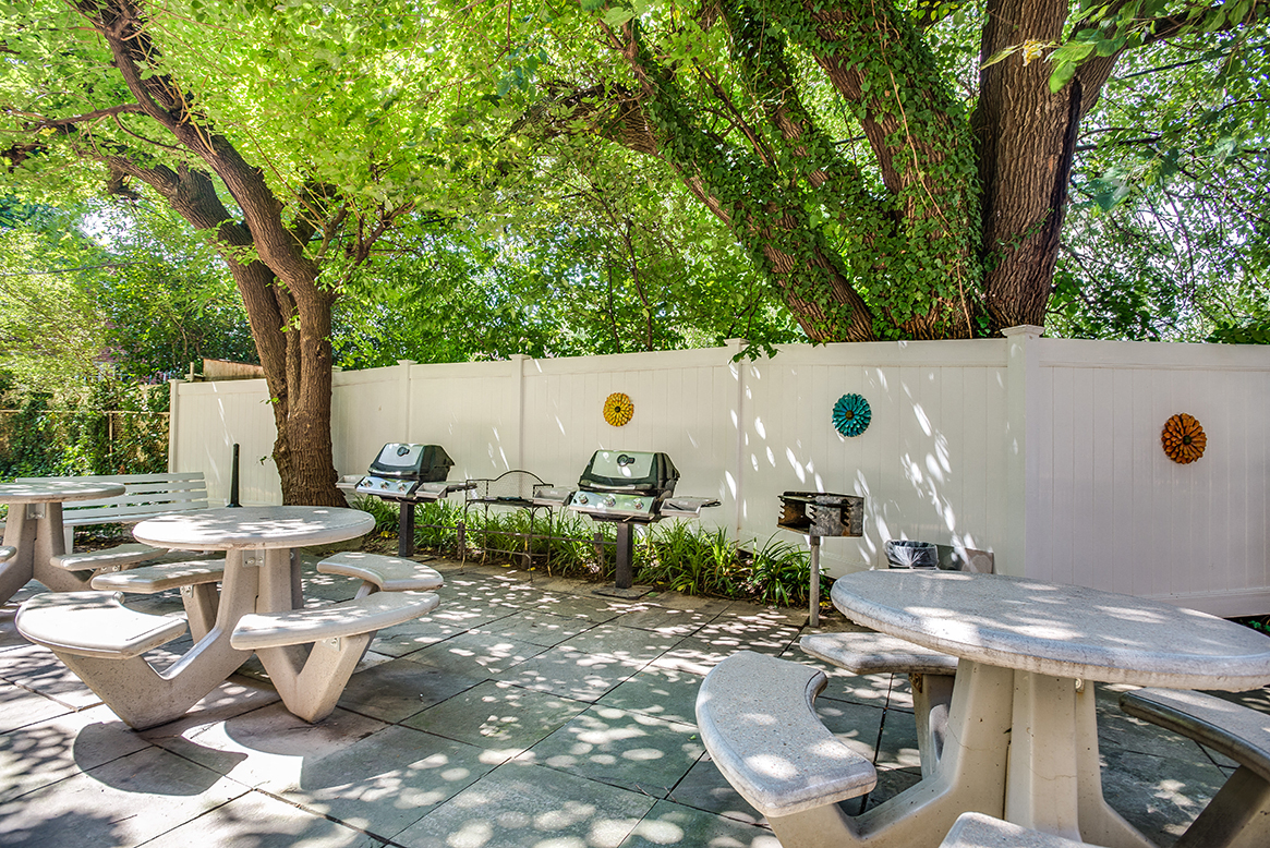 Courtyard with grilling area and seating at Mason Hall in Alexandria, VA 22314