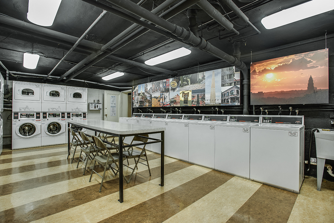 Laundry room with seating area at Mason Hall in Alexandria, VA 22314