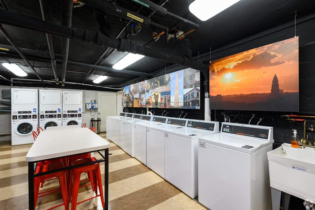 A laundry facility with large hanging photos in Old Town, Alexandria, VA.
