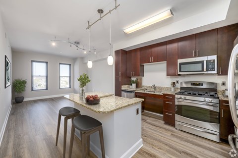 Kitchen with granite countertop and stainless steel appliances at Park Place at Petworth, Washington, DC 20011