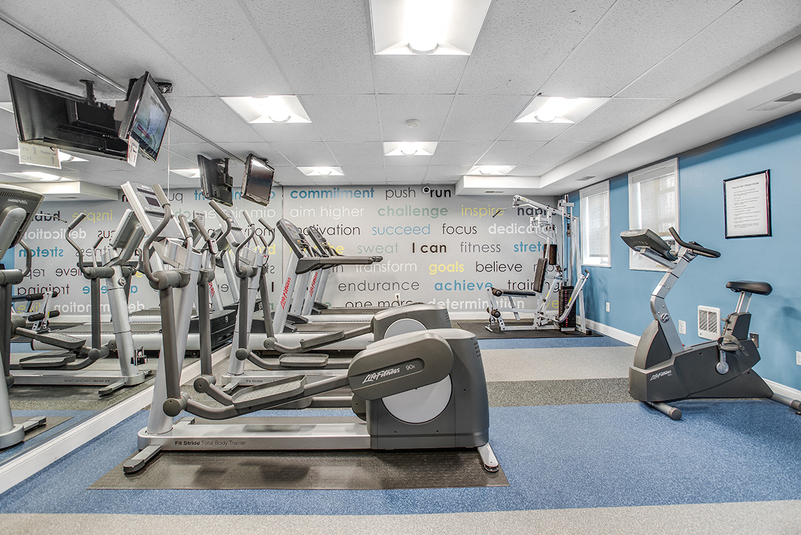Fitness center with treadmills, machines and free weights at President Madison, Washington, Washington