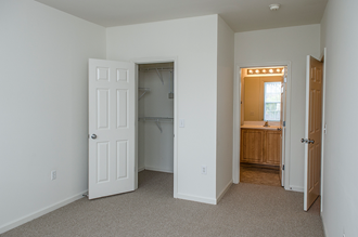 Bedroom and bathroom entrance at The Residences at King Farm Apartments, Maryland - Photo Gallery 5