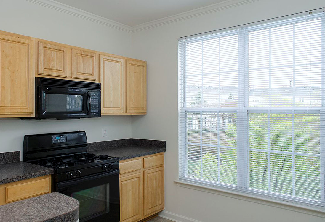 Kitchen with classic appliances at The Residences at King Farm Apartments, Rockville, MD