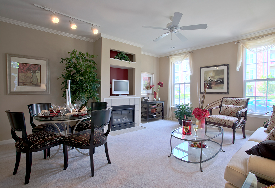 Townhome living area with fireplace (staged) at The Residences at King Farm Apartments, Rockville, 20850