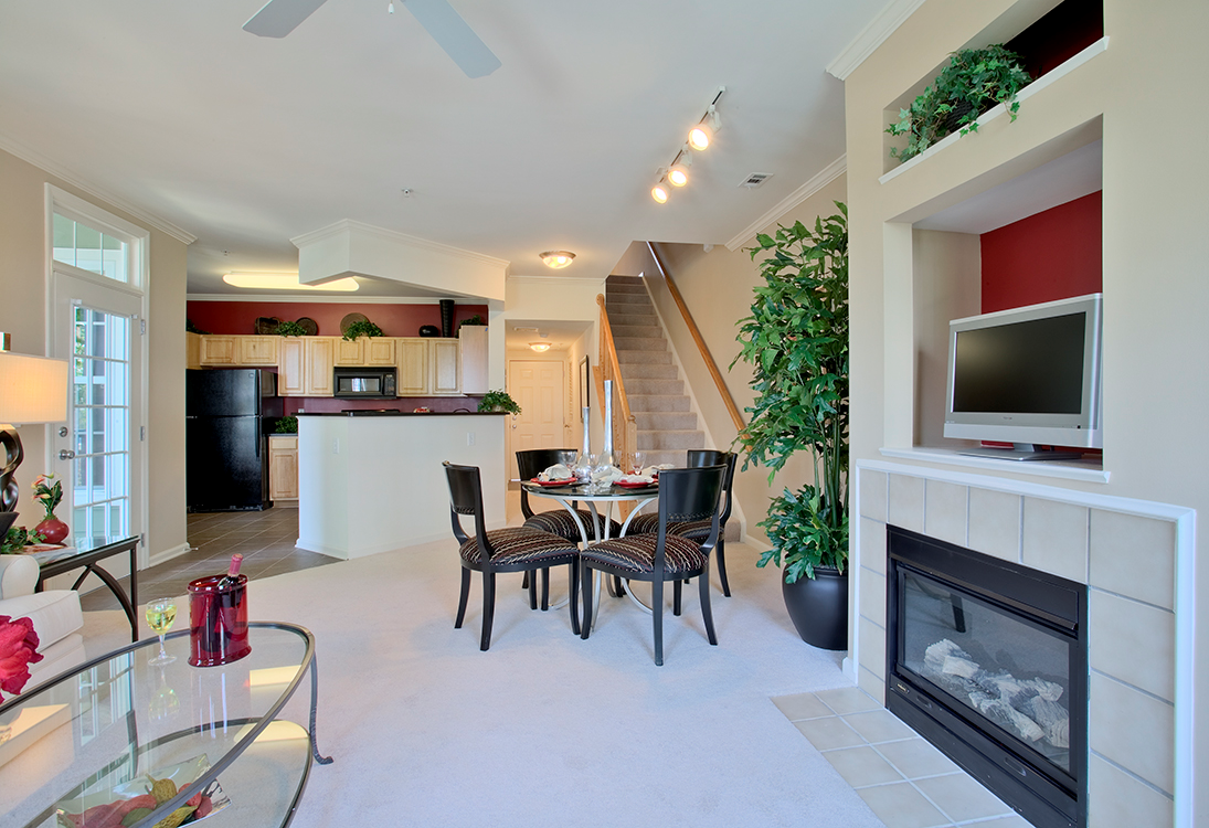 Living Area With Fireplace at The Residences at King Farm Apartments, Rockville