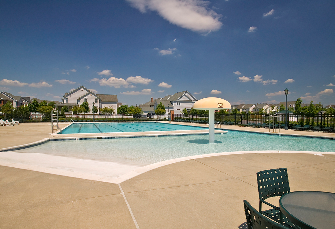 Pool with seating area at The Residences at King Farm Apartments, Maryland
