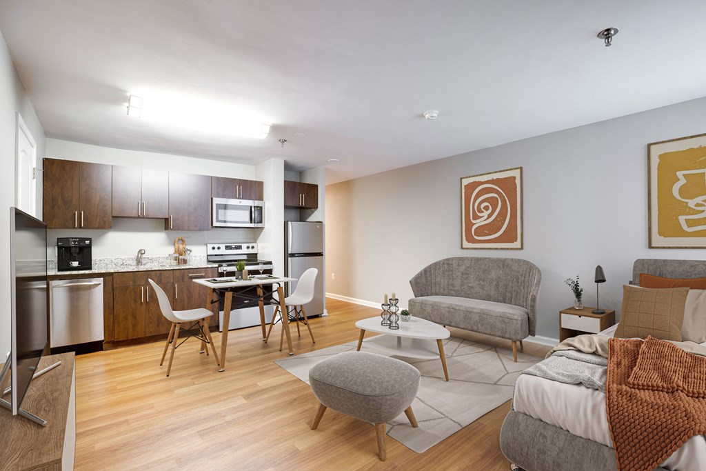 a living room and kitchen with a couch and chairs and a table at Residences at Rio, Gaithersburg, MD, 20878