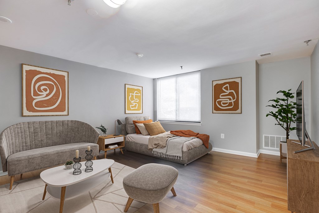 a living room with a couch and a bed at Residences at Rio, Maryland