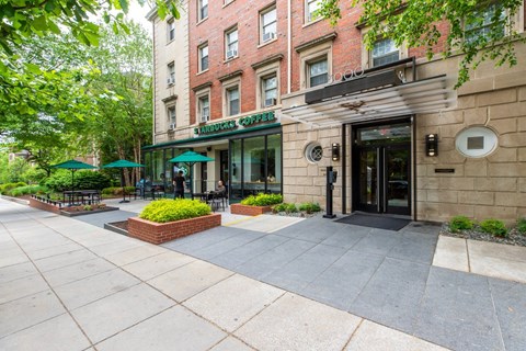 A building with a green awning and a sign that says