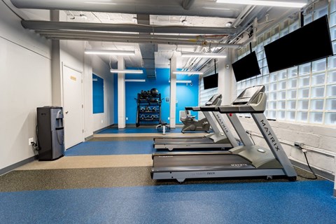 Fitness center with cardio equipment at The Diplomat Apartments in DC