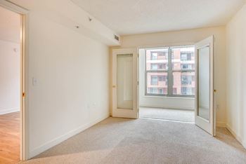 a bedroom with an open door and a window at West End Residences, Washington, 20037