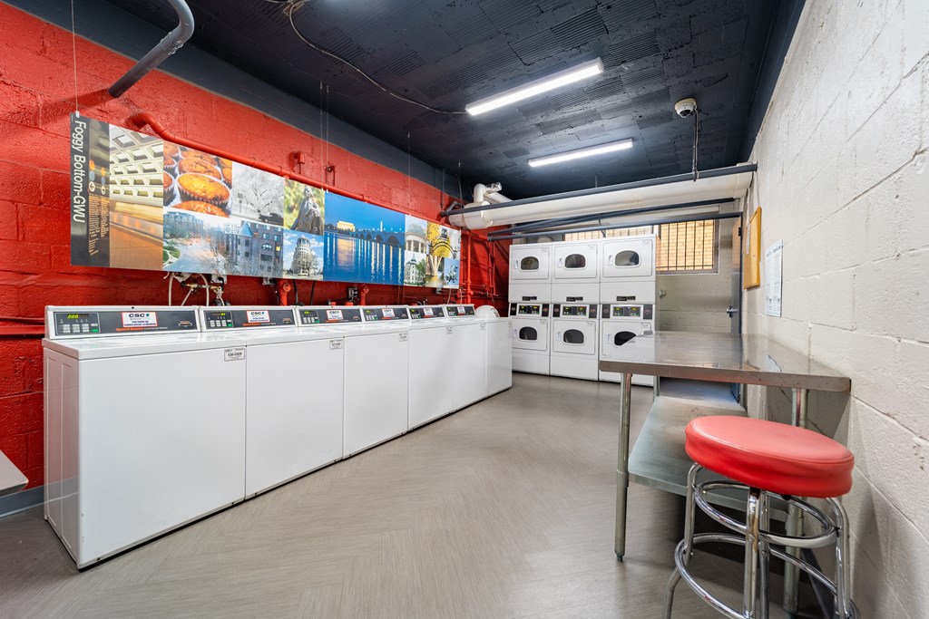 Card-operated laundry room with washing machines, dryers at The York and Potomac Park in Washington DC 20006