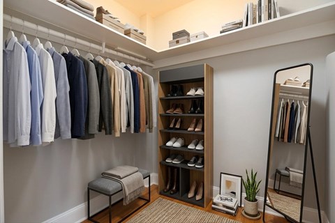 Walk-in closet (virtually staged) for studio apartment at 4115 Wisconsin Avenue Apartments in Washington, DC 20016