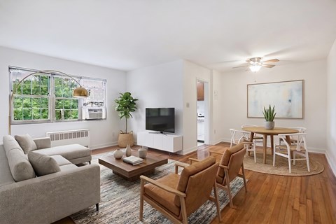 Living room, dining area and kitchen (virtually staged) at Mason Hall in Alexandria, VA 22314