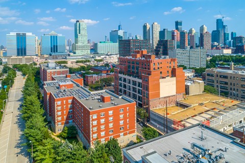 A cityscape with a mix of modern and older buildings.